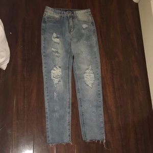 never worn distressed denim jeans